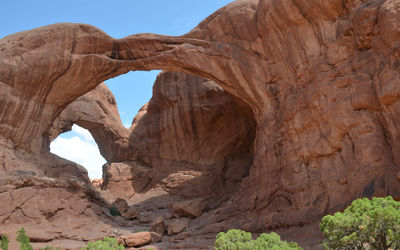 Early summer in utah - looking up at double arch in arches national park