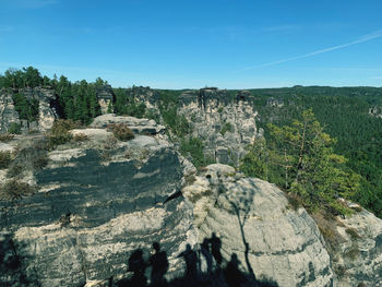 Scenic view of mountains against clear blue sky