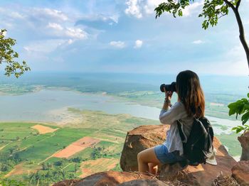 Woman taking picture outdoors