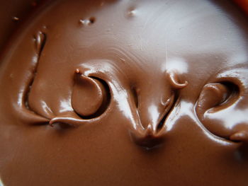 Directly above shot of love text in chocolate