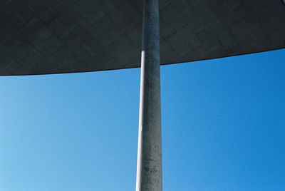 Low angle view of pole against blue sky