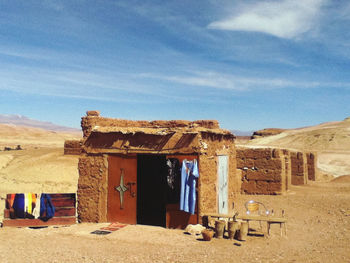 Built structure on desert against sky