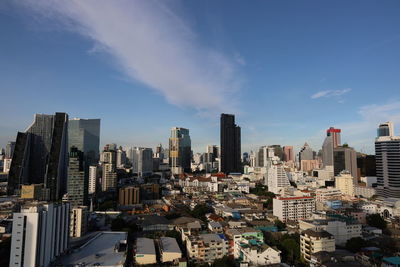 Modern buildings in city against sky