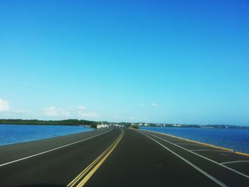 Empty road against sky