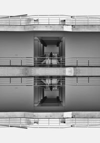 Low angle view of bridge over building against sky