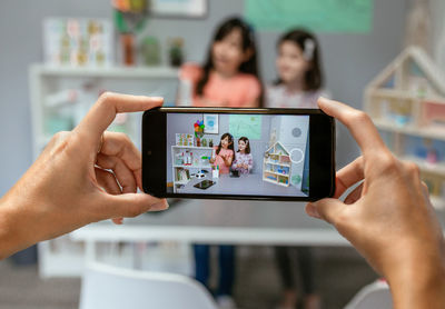 Midsection of woman using mobile phone