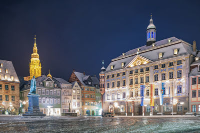 View of buildings in city at night