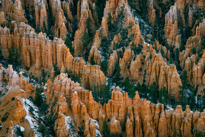 Far away zoom shot of bryce canyon national park of the hoodoos at inspiration point during winter
