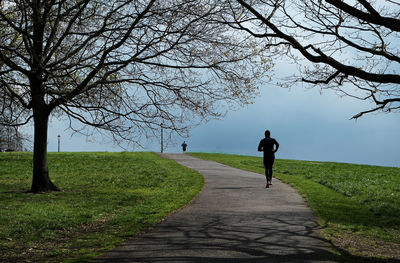 Rear view of person on footpath