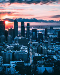 High angle view of buildings against sky during sunset