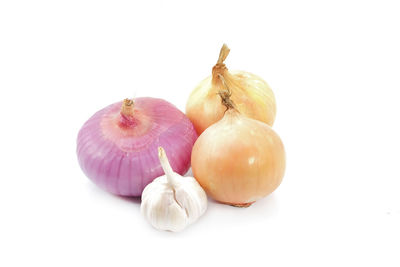 Close-up of eggs against white background