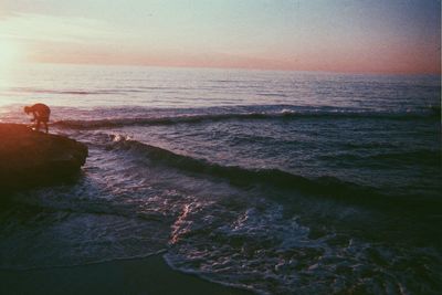 Scenic view of calm sea at sunset