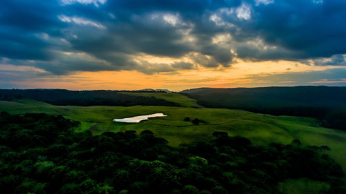 Scenic view of landscape against sky during sunset