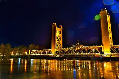 Bridge over river at night