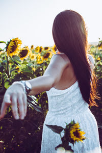 Woman standing amidst plants