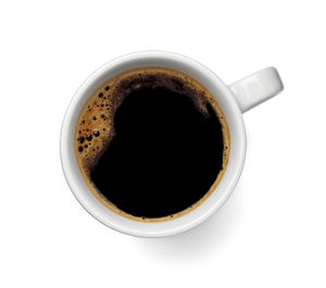 High angle view of coffee cup over white background