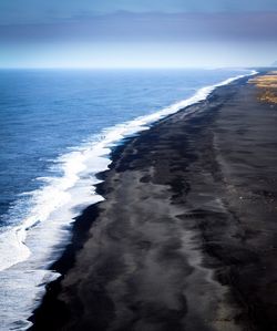 Scenic view of beach against clear sky