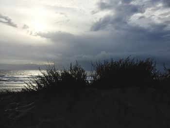 Scenic view of sea against cloudy sky