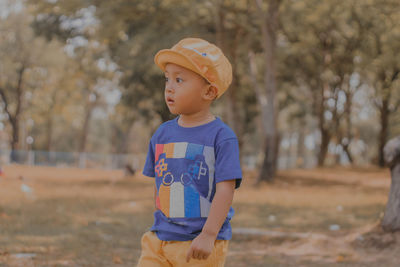 Portrait of boy standing outdoors