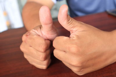 Close-up of man holding hands