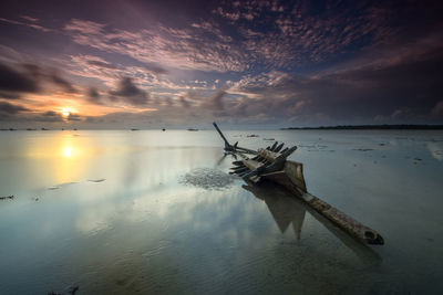 Scenic view of sea against sky at sunset