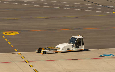 High angle view of airplane on airport runway