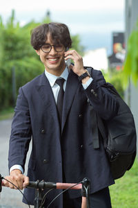 Portrait of businessman using mobile phone