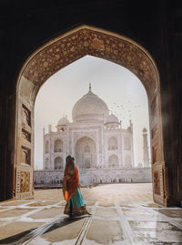 Full length rear view of woman in temple