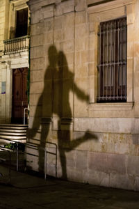 Shadow of man on window