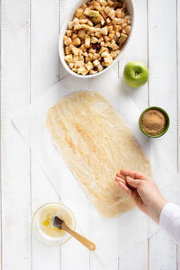 High angle view of person preparing food on table