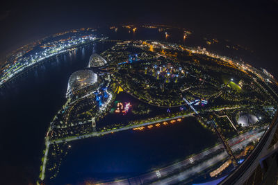 High angle view of illuminated city buildings at night