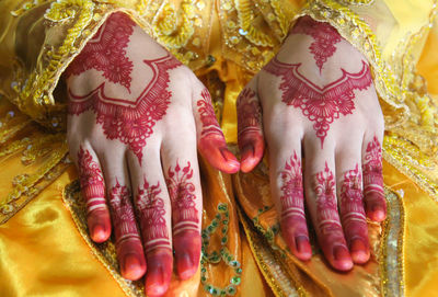 Close-up of woman with tattoo on hand