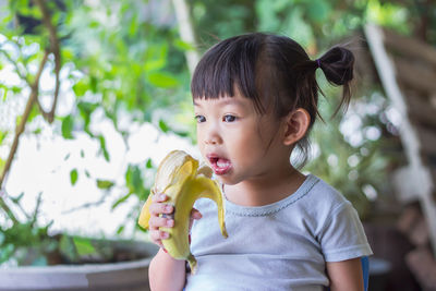 Portrait of cute girl eating food