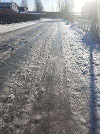 Surface level of tire tracks on snow covered field