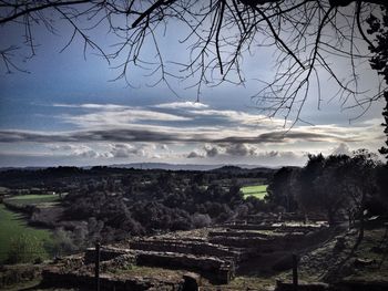 Scenic view of landscape against cloudy sky