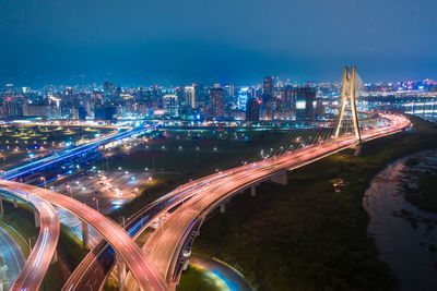 High angle view of illuminated highway at night