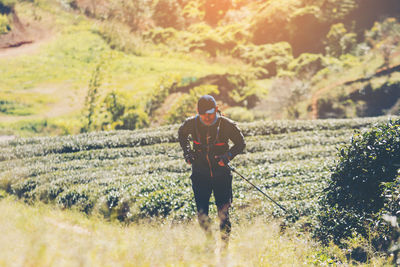 Full length of man on field