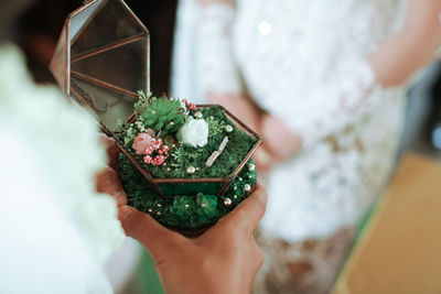 Close-up of woman holding christmas ornament