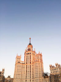 Low angle view of modern building against blue sky