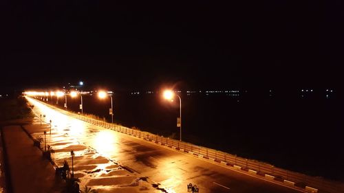 Illuminated street lights at night