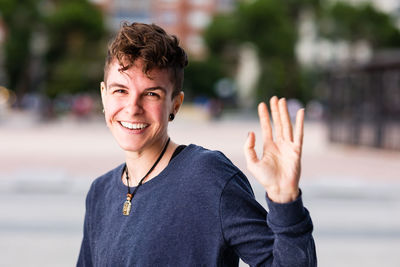 Portrait of smiling young man standing outdoors