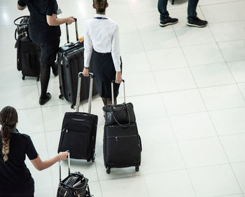 High angle view of people with luggage at airport