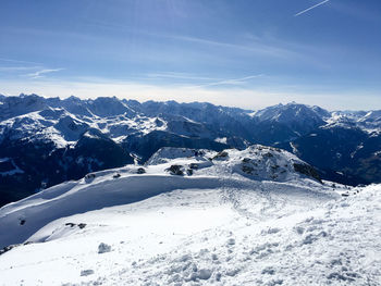 Scenic view of snow covered mountains against sky