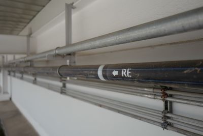 Low angle view of pipe on wall