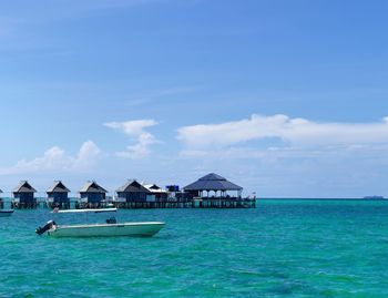 Scenic view of sea against blue sky