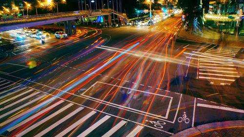 High angle view of light trails on road