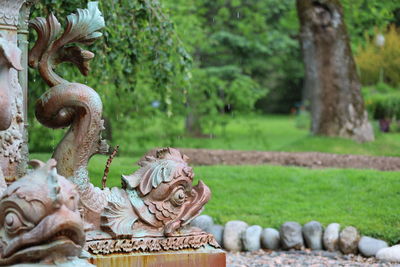 Statue against trees in park