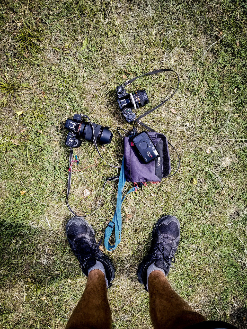 LOW SECTION OF MAN STANDING ON GRASS