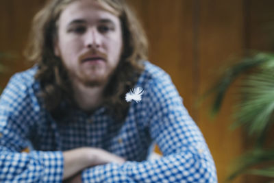 Portrait of young man sitting outdoors