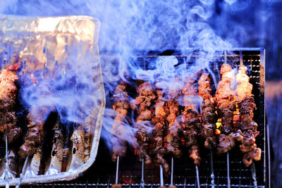 Close-up of meat on barbecue grill